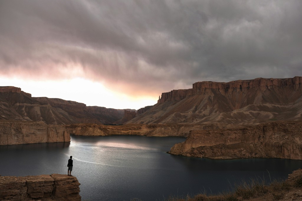 A lone figure overlooking the lakes of Band-e Amir, Afghanistan
